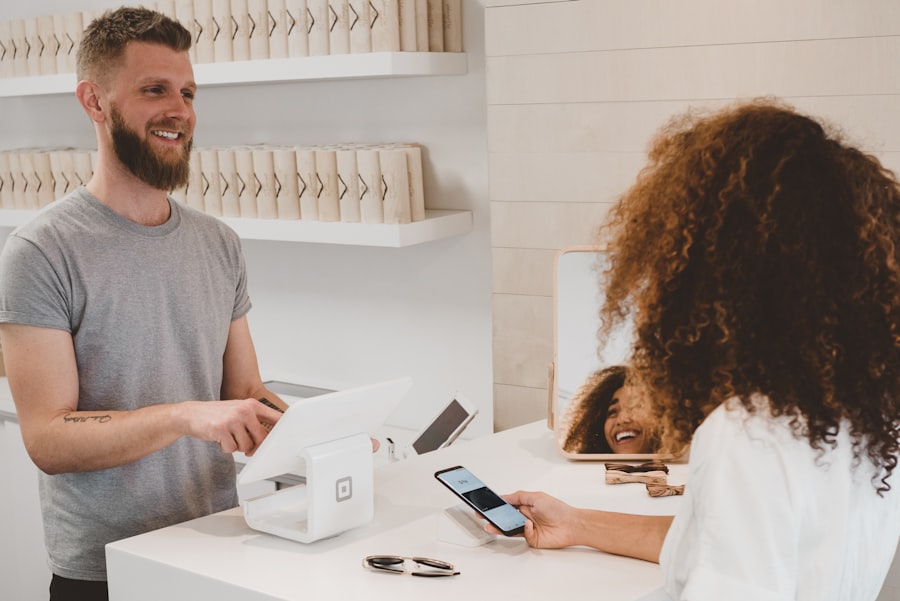 Retail staff assisting a customer at the counter